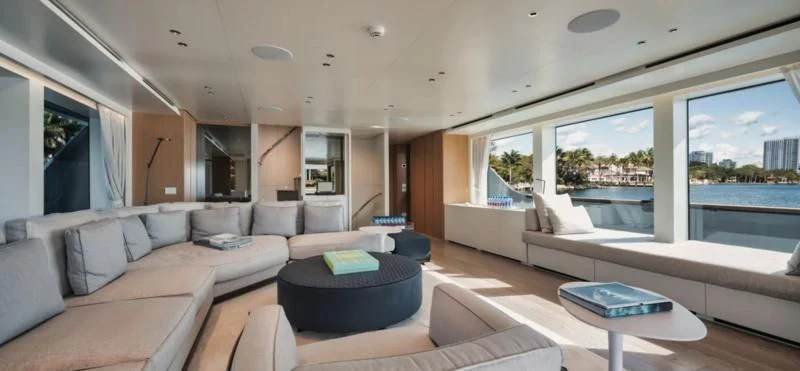 a living room with a large window aboard DON'T TELL MOM Yacht for Sale