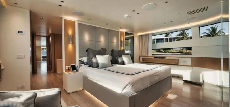 a room with a bed and a desk aboard DON'T TELL MOM Yacht for Sale
