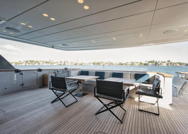 a room with a table and chairs aboard DON'T TELL MOM Yacht for Sale