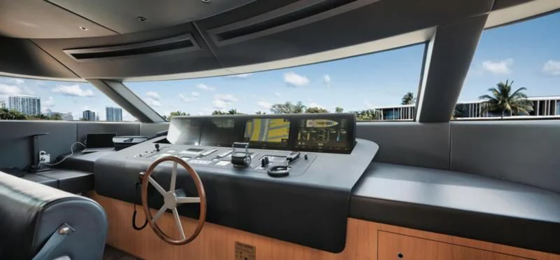 a large boat on a deck aboard DON'T TELL MOM Yacht for Sale