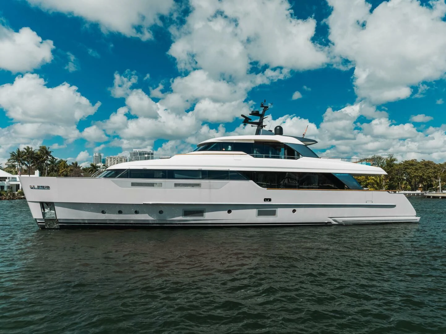 a white yacht on the water aboard DON'T TELL MOM Yacht for Sale
