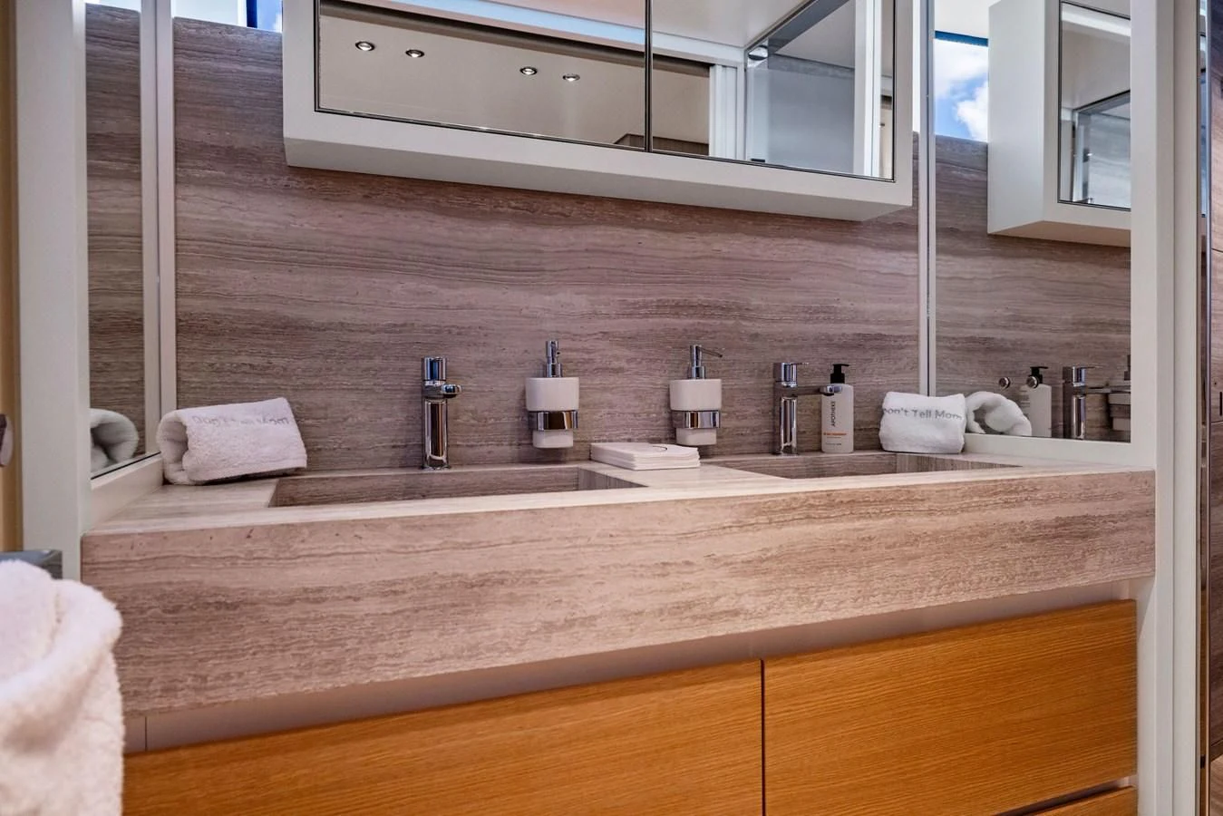 a bathroom with a large mirror aboard DON'T TELL MOM Yacht for Sale