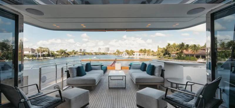 a large room with a large deck and a pool aboard DON'T TELL MOM Yacht for Sale