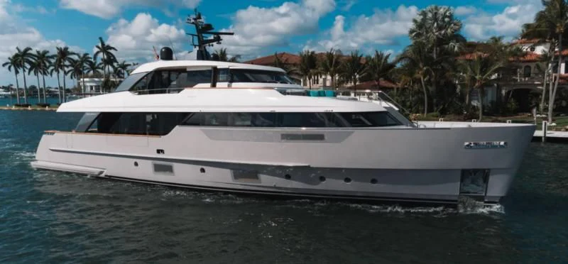 a white yacht on the water aboard DON'T TELL MOM Yacht for Sale