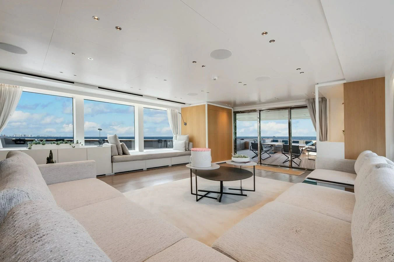 a living room with a large window aboard DON'T TELL MOM Yacht for Sale