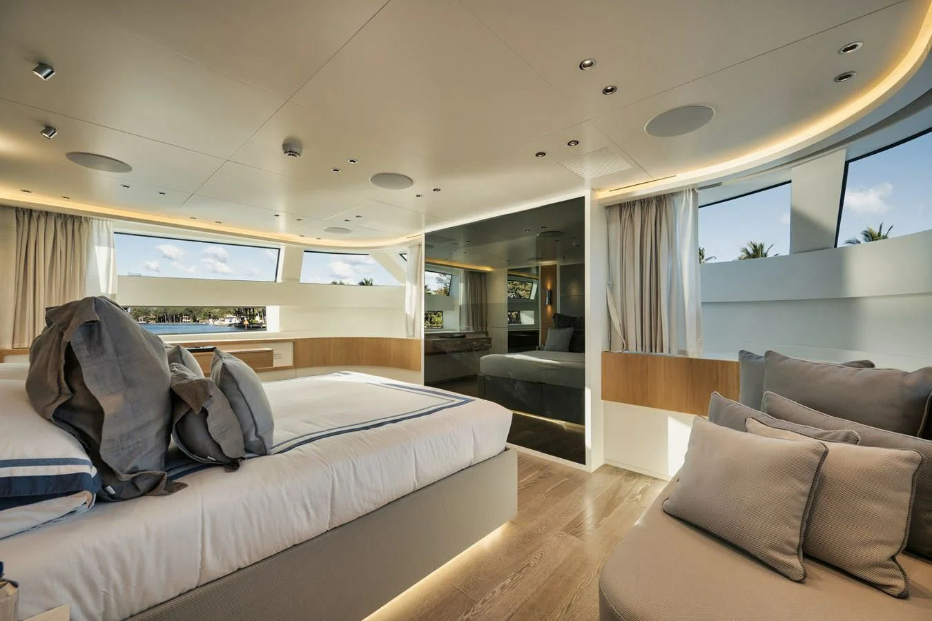 a large living room with a large bed and a large window aboard DON'T TELL MOM Yacht for Sale