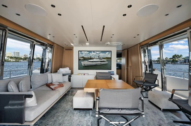 a living room with a couch and a table aboard DON'T TELL MOM Yacht for Sale