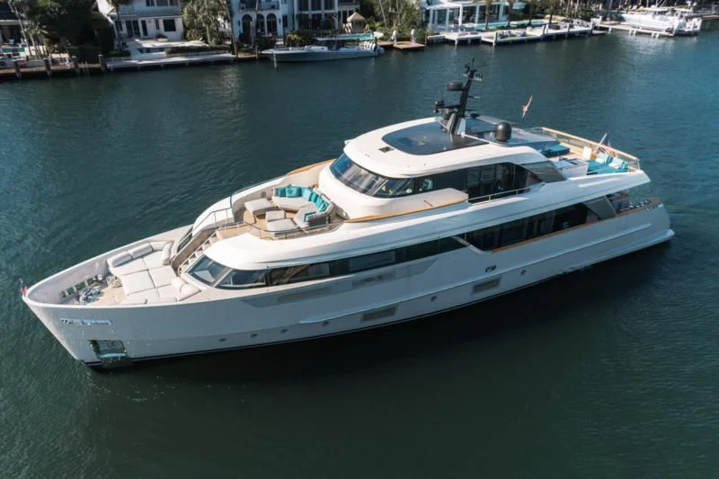 a white yacht on the water aboard DON'T TELL MOM Yacht for Sale