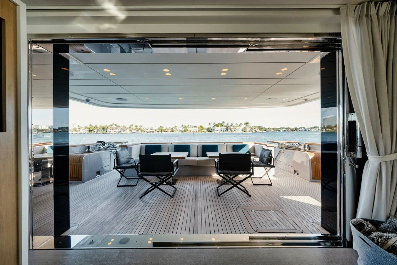 a room with a view of the water and the deck aboard DON'T TELL MOM Yacht for Sale