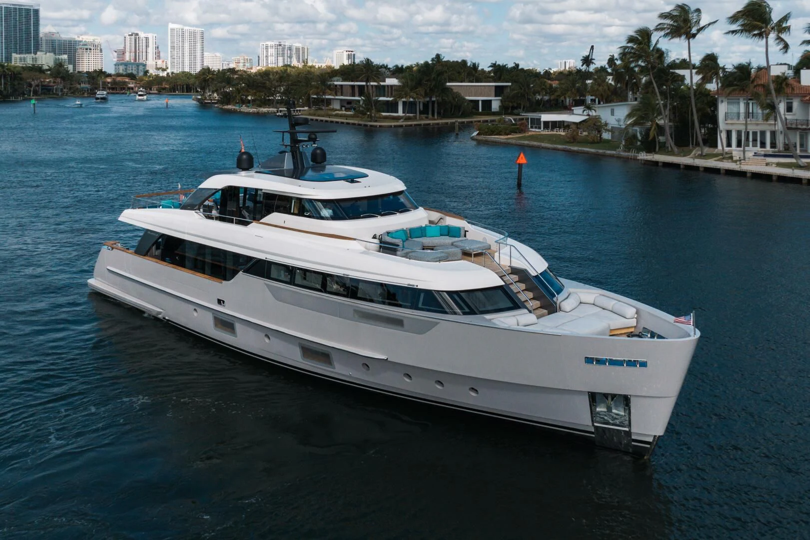 a white yacht in the water aboard DON'T TELL MOM Yacht for Sale
