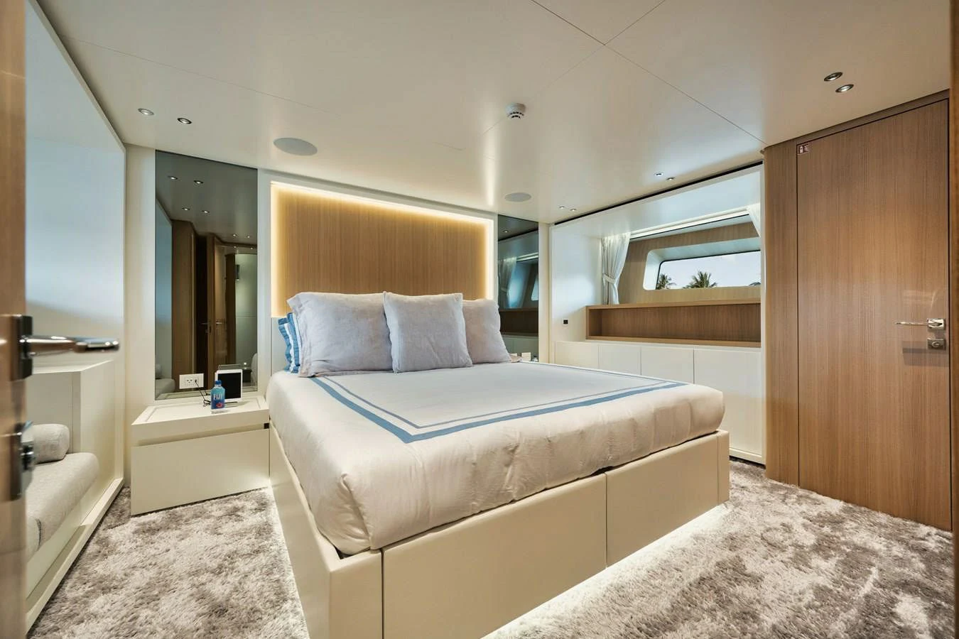 a bedroom with a bed and a mirror aboard DON'T TELL MOM Yacht for Sale