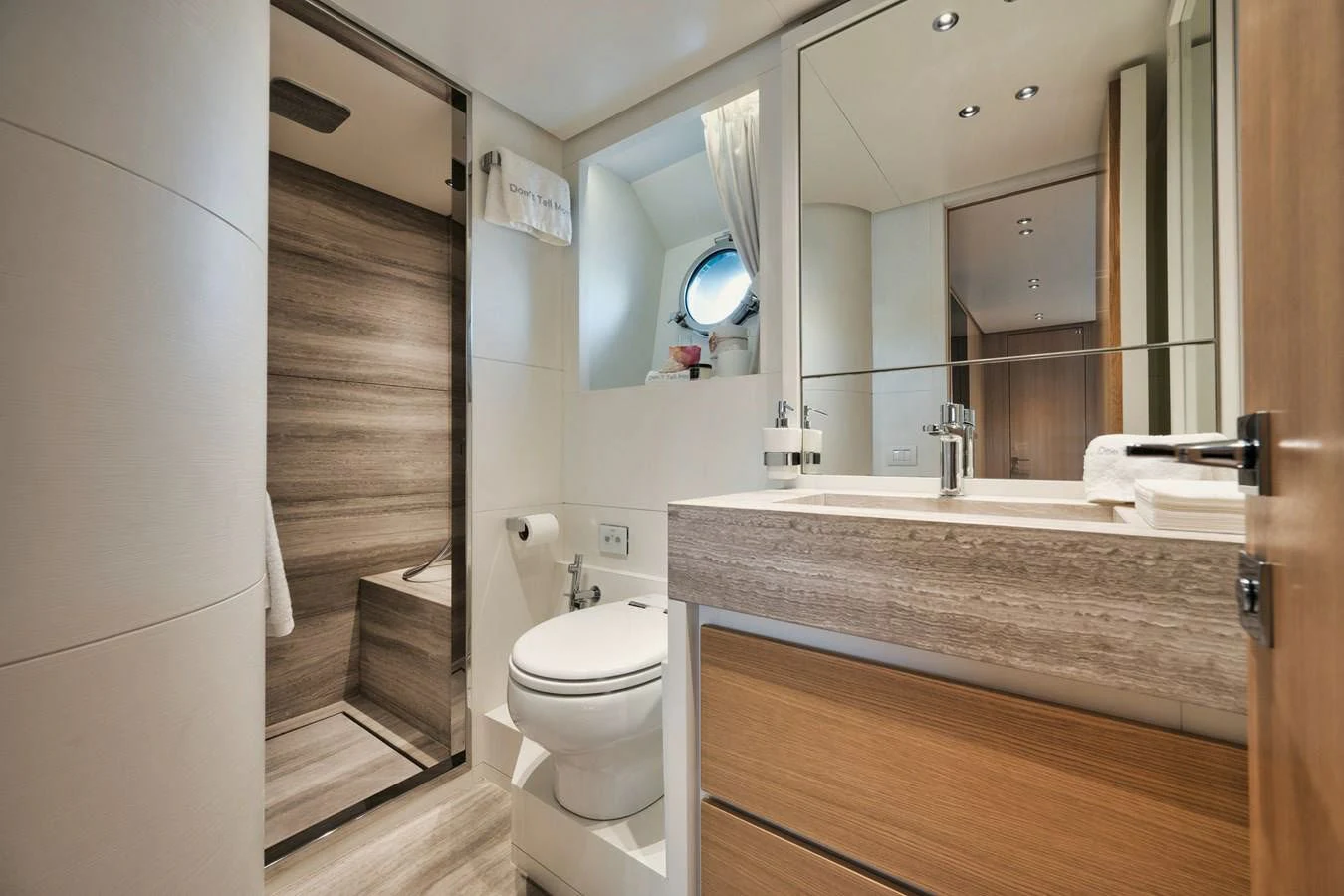 a bathroom with a large mirror aboard DON'T TELL MOM Yacht for Sale