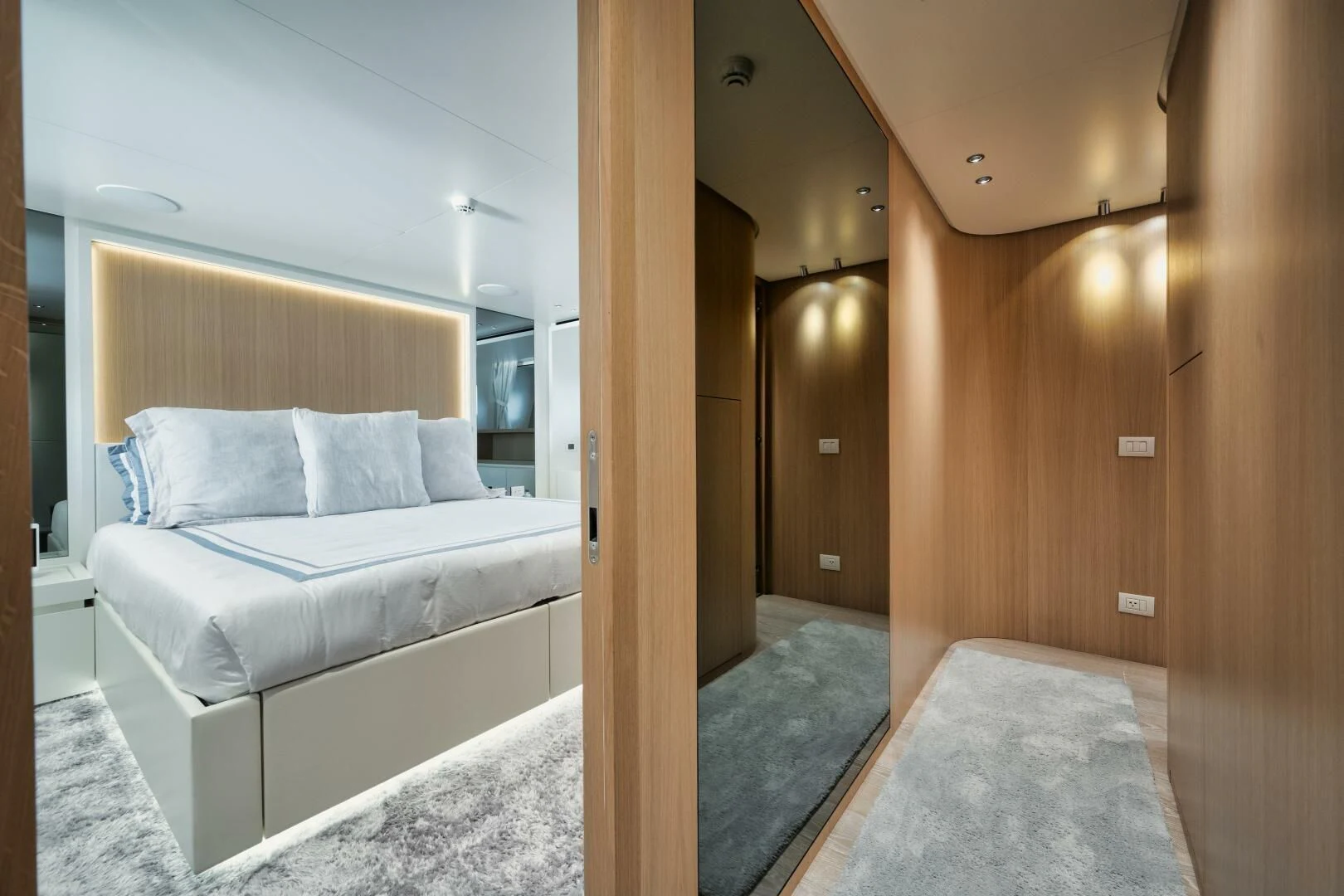 a room with a bed and a mirror aboard DON'T TELL MOM Yacht for Sale