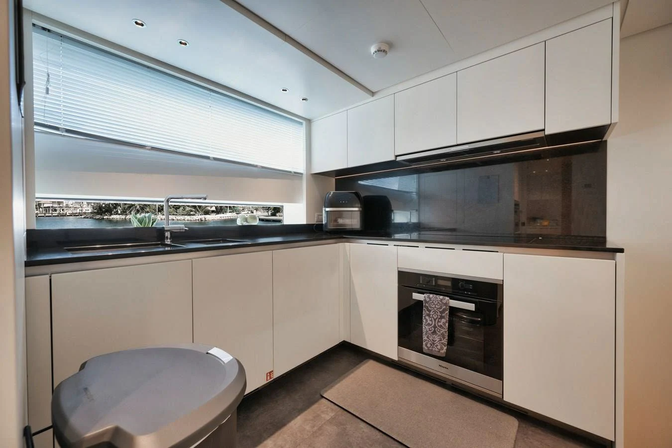 a kitchen with white cabinets aboard DON'T TELL MOM Yacht for Sale