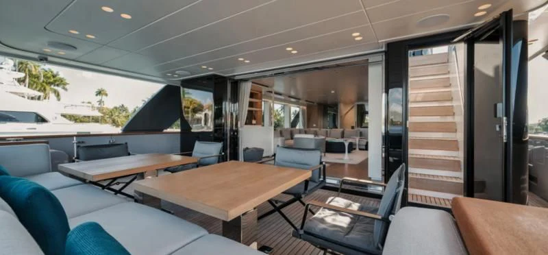 inside of a vehicle with a table and chairs and a large window aboard DON'T TELL MOM Yacht for Sale