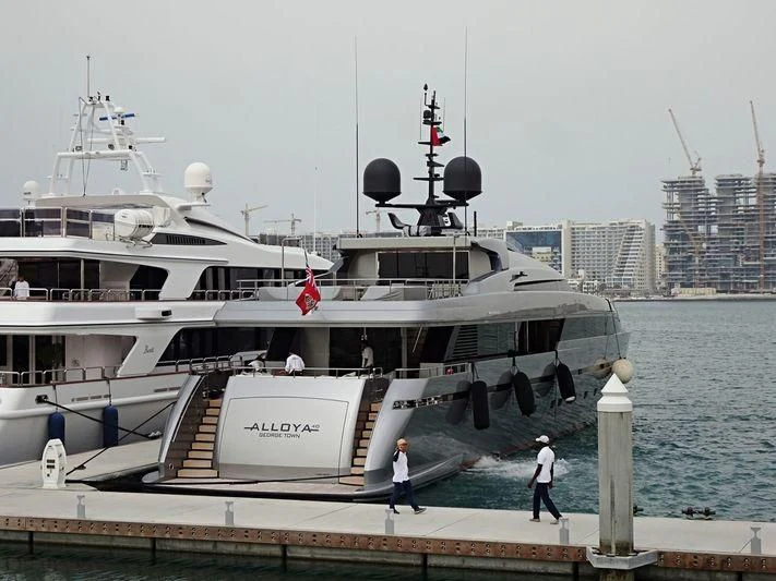 a large white boat docked at a pier aboard ALLOYA 40 Yacht for Sale