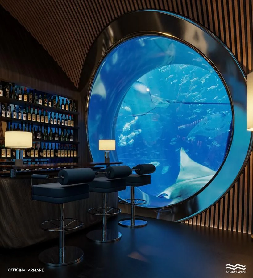 a room with a globe and a table and chairs aboard NAUTILUS Yacht for Sale
