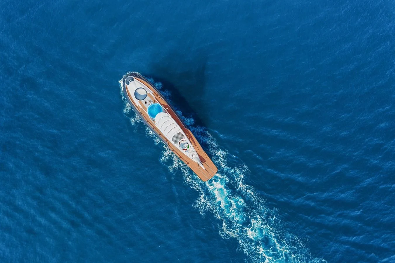 a white surfboard in the water aboard NAUTILUS Yacht for Sale