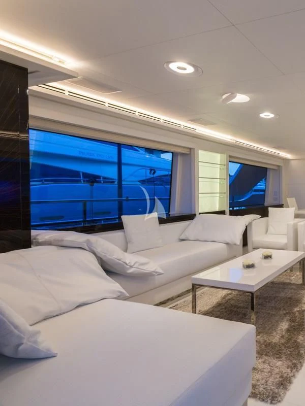 a room with a couch and a table and a tv aboard GALA Yacht for Sale