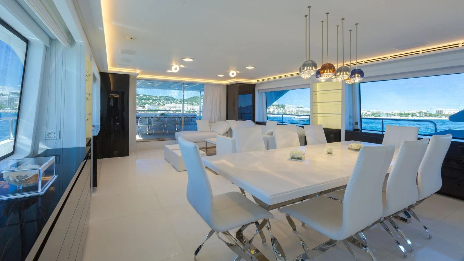 a large dining room with a large window overlooking a large body of water aboard GALA Yacht for Sale