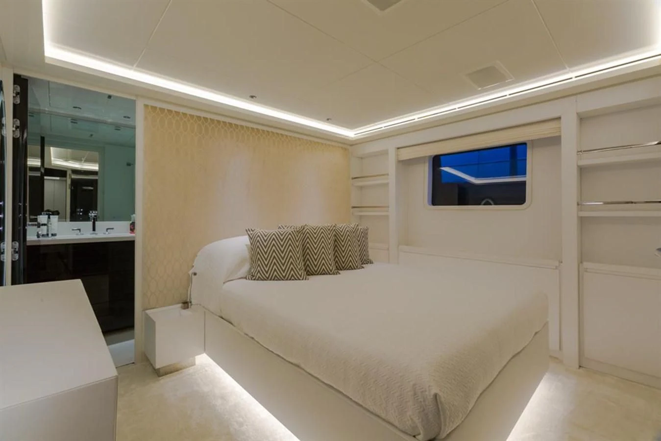 a room with a bed and a tv on the wall aboard GALA Yacht for Sale