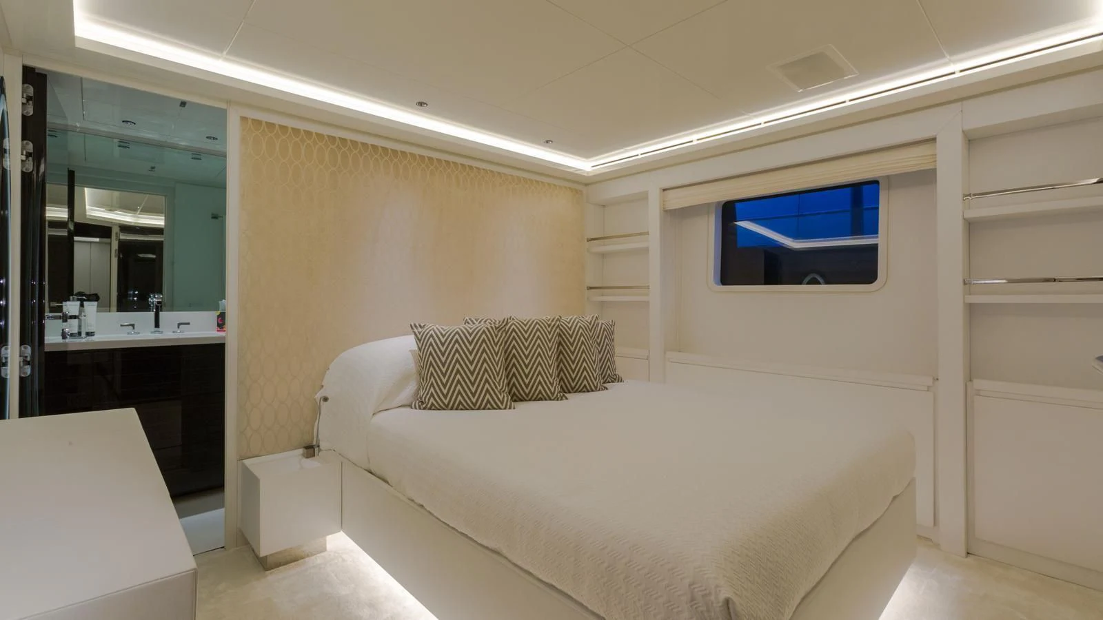 a room with a bed and a tv on the wall aboard GALA Yacht for Sale