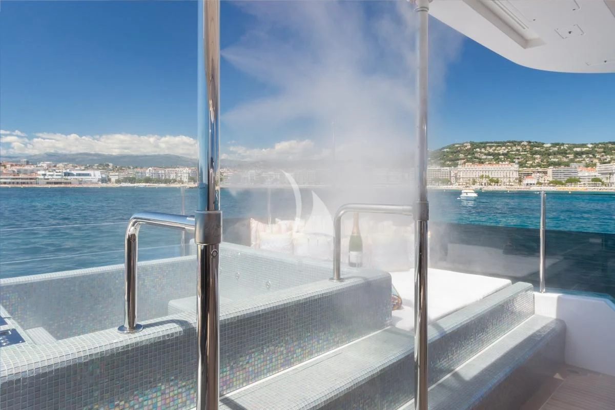 a balcony overlooking a body of water aboard GALA Yacht for Sale