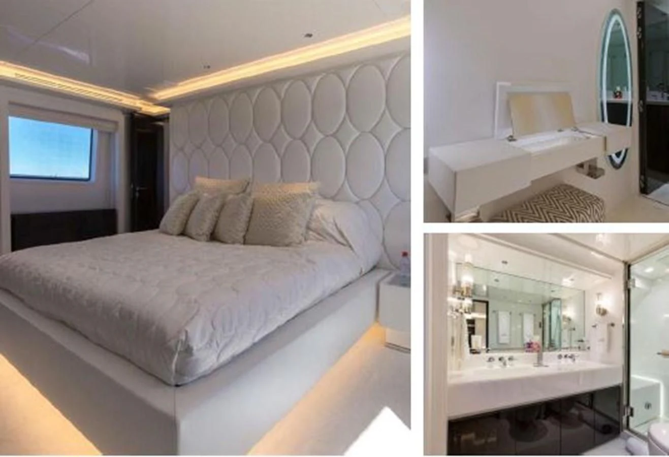 a bedroom with a bed and a desk aboard GALA Yacht for Sale