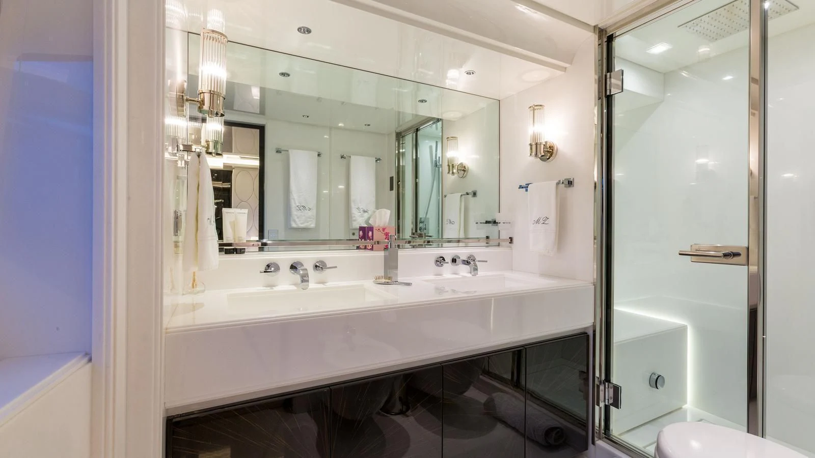 a bathroom with a large mirror aboard GALA Yacht for Sale
