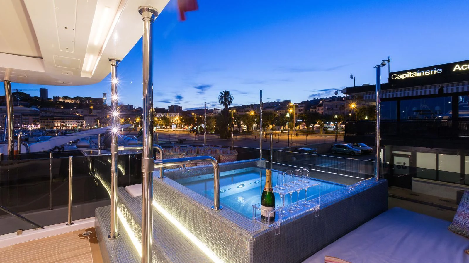 a glass bottle on a deck aboard GALA Yacht for Sale