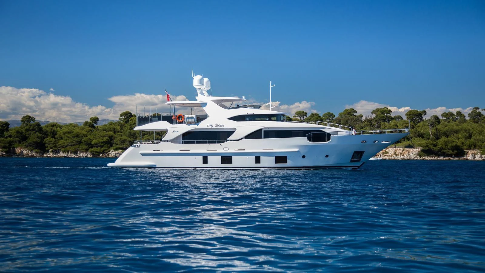 a white yacht on the water aboard GALA Yacht for Sale