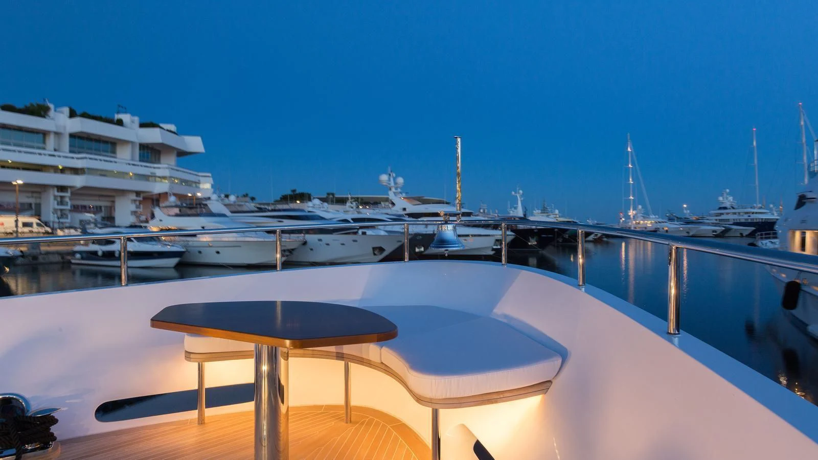 a large white yacht in a harbor aboard GALA Yacht for Sale
