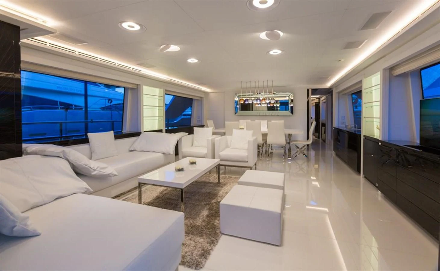 a living room with a large screen aboard GALA Yacht for Sale