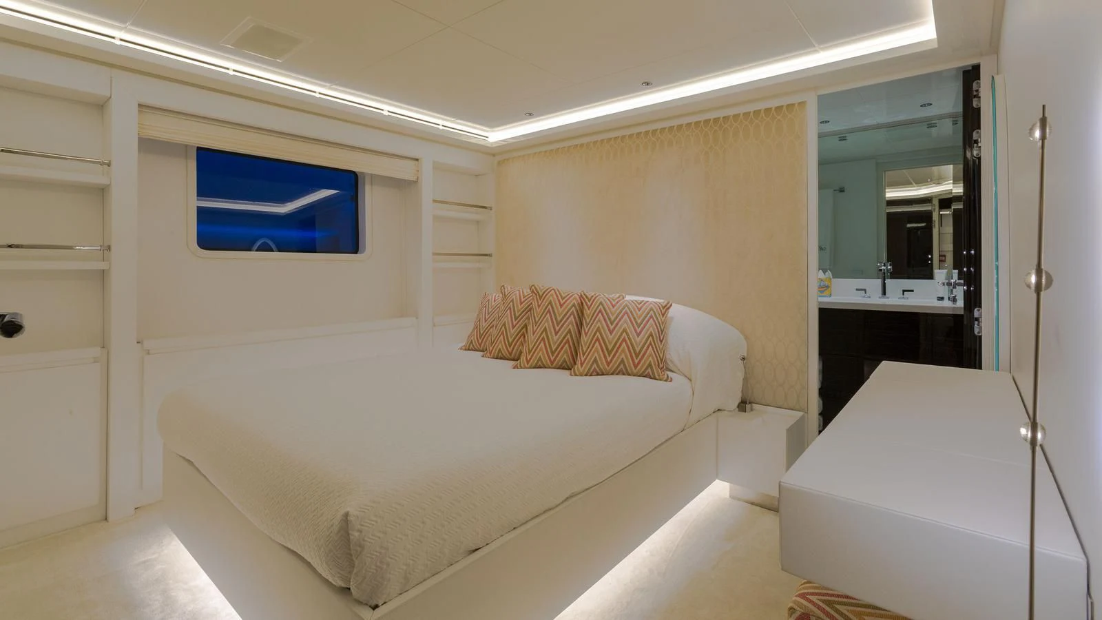 a room with a bed and a desk aboard GALA Yacht for Sale