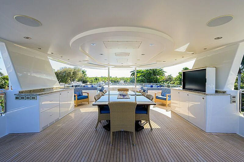 a room with a table and chairs aboard BLUE TIME Yacht for Sale