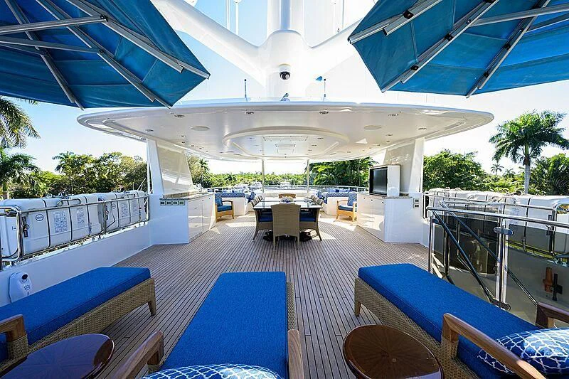 a pool with a deck and lounge chairs aboard BLUE TIME Yacht for Sale