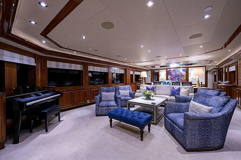 a living room with a piano aboard BLUE TIME Yacht for Sale