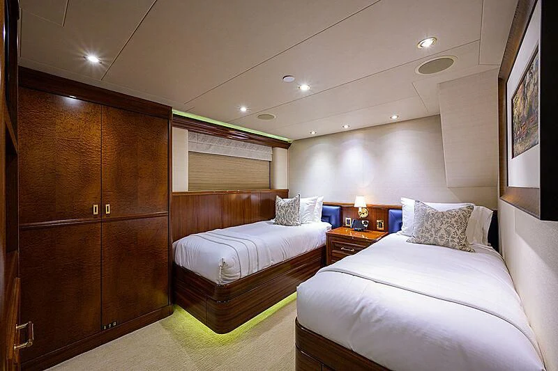 a bedroom with a bed and a closet aboard BLUE TIME Yacht for Sale