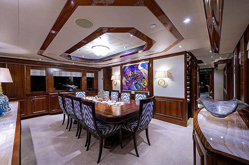 a dining room with a table and chairs aboard BLUE TIME Yacht for Sale