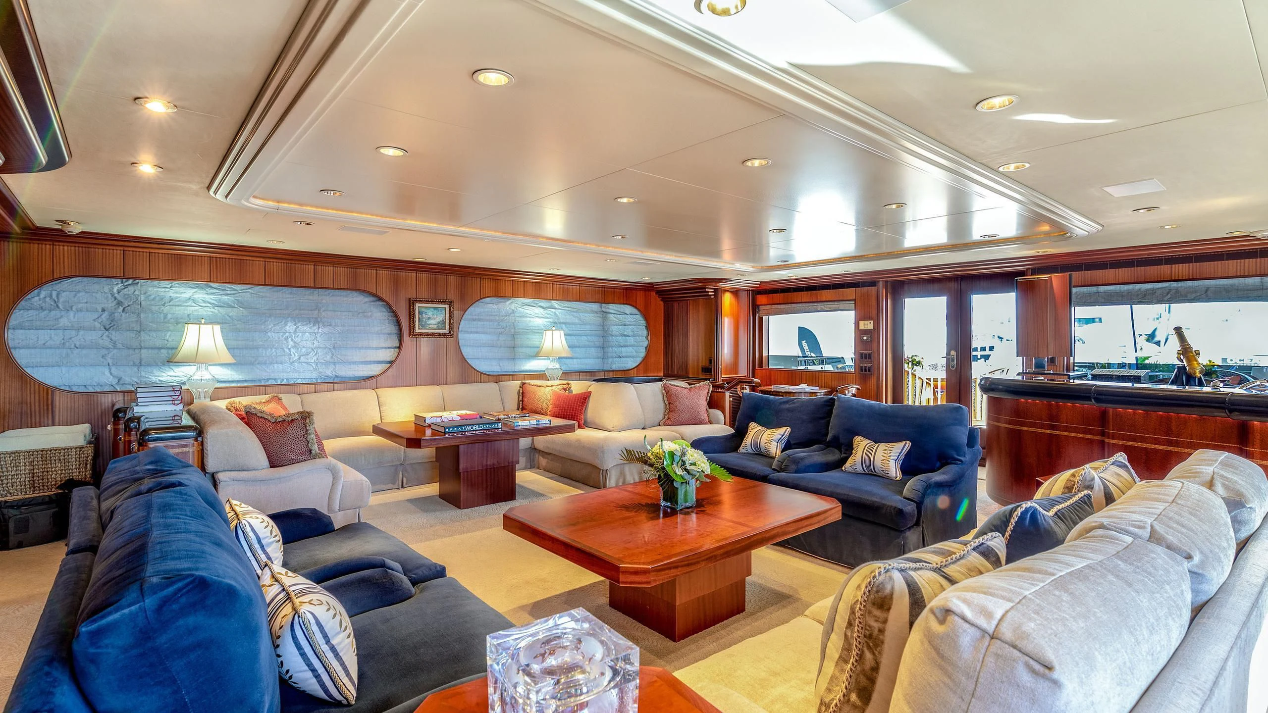 a living room with a large window aboard NEVER ENOUGH Yacht for Charter