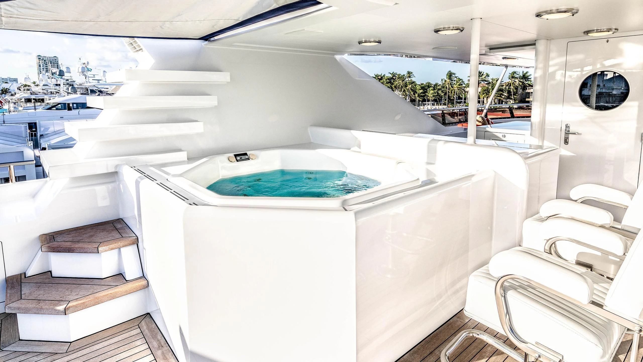 a large white swimming pool aboard NEVER ENOUGH Yacht for Charter