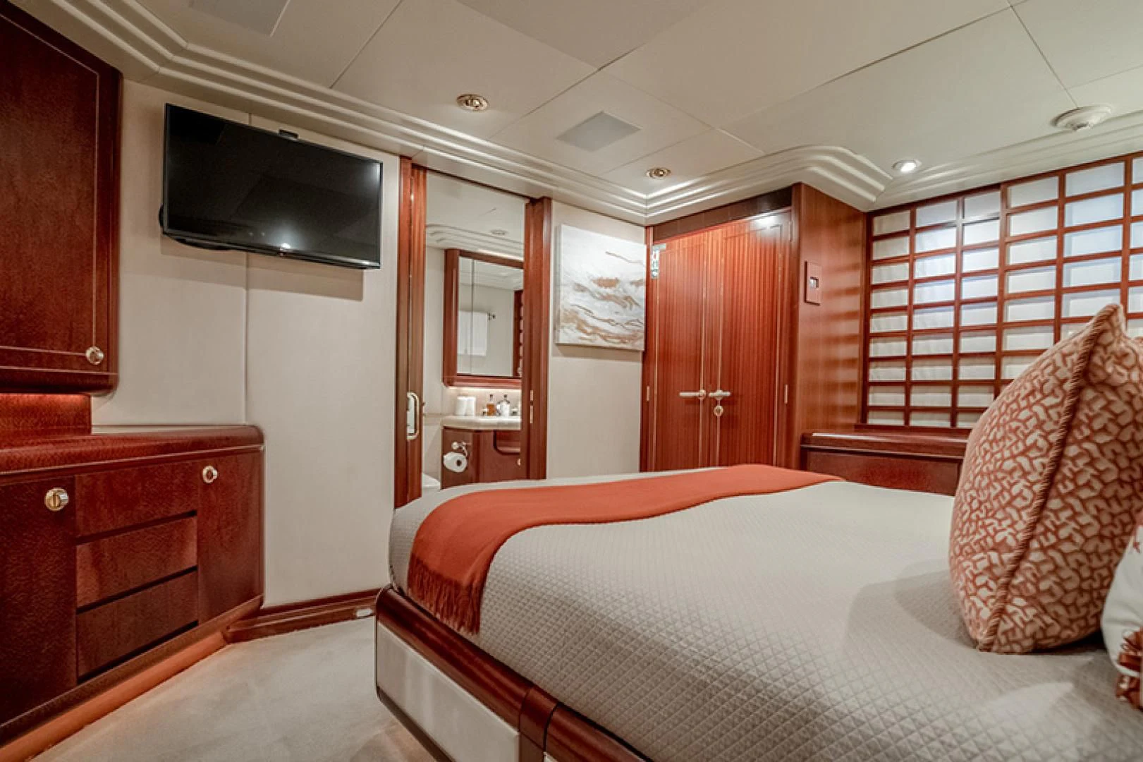 a bedroom with a bed and tv aboard NEVER ENOUGH Yacht for Charter