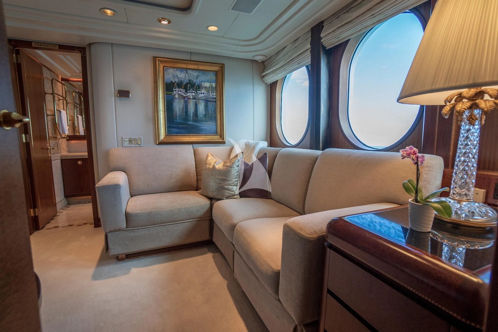 a living room with a couch and a table aboard NEVER ENOUGH Yacht for Charter