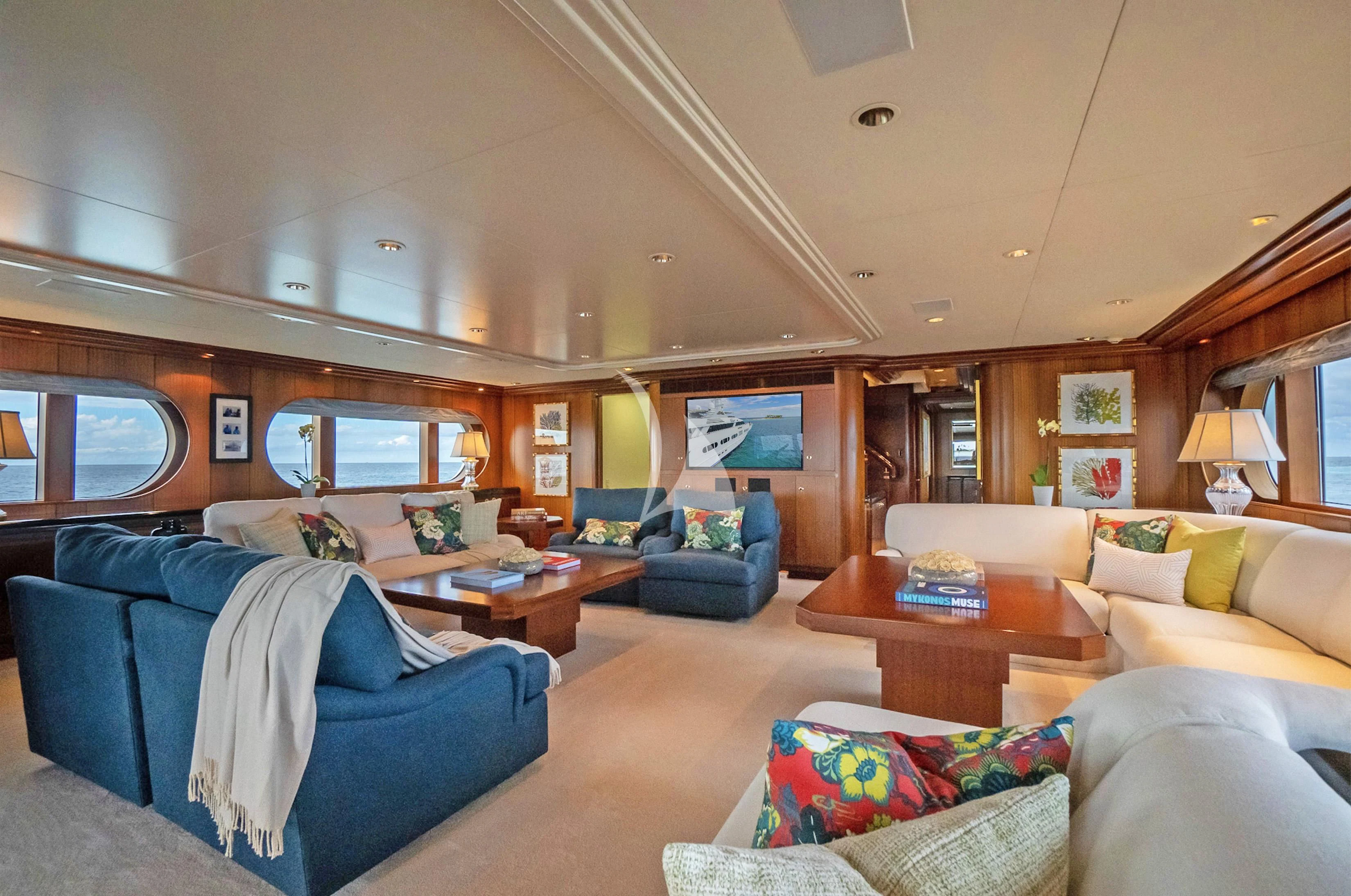 a living room with a couch and a table aboard NEVER ENOUGH Yacht for Charter