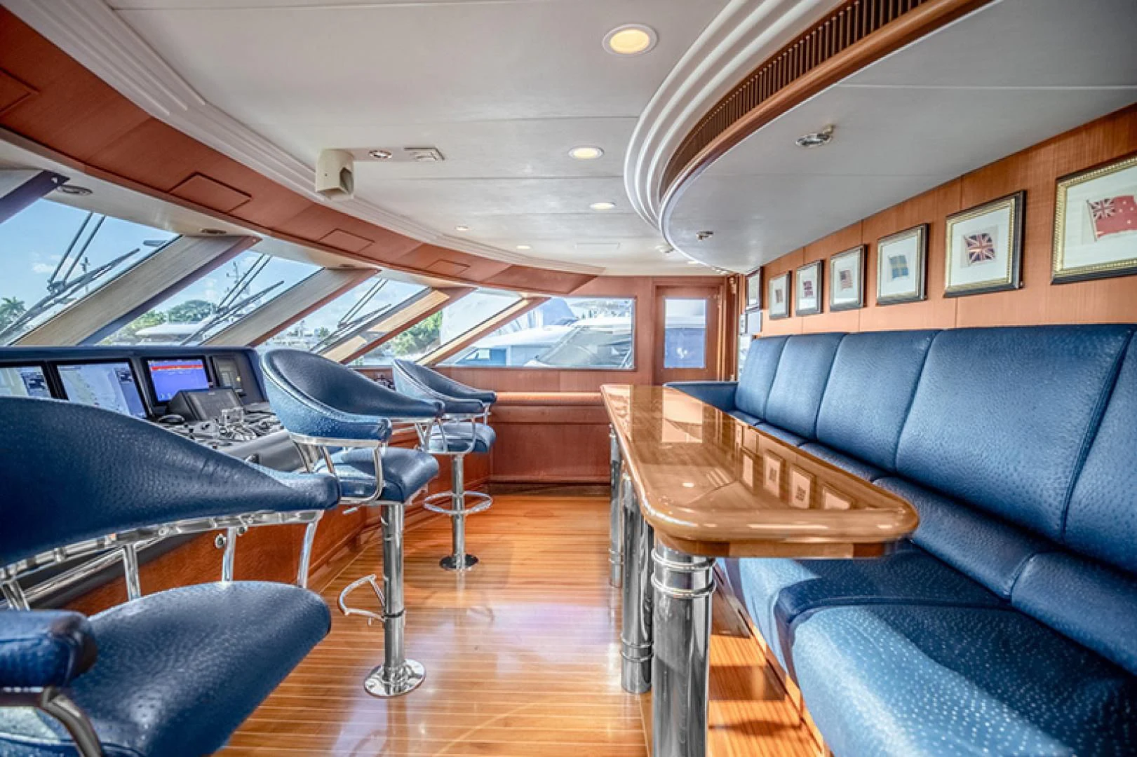 a room with a couch and a table and chairs aboard NEVER ENOUGH Yacht for Charter