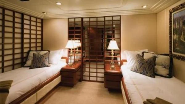a bedroom with a bed and a closet aboard NEVER ENOUGH Yacht for Charter