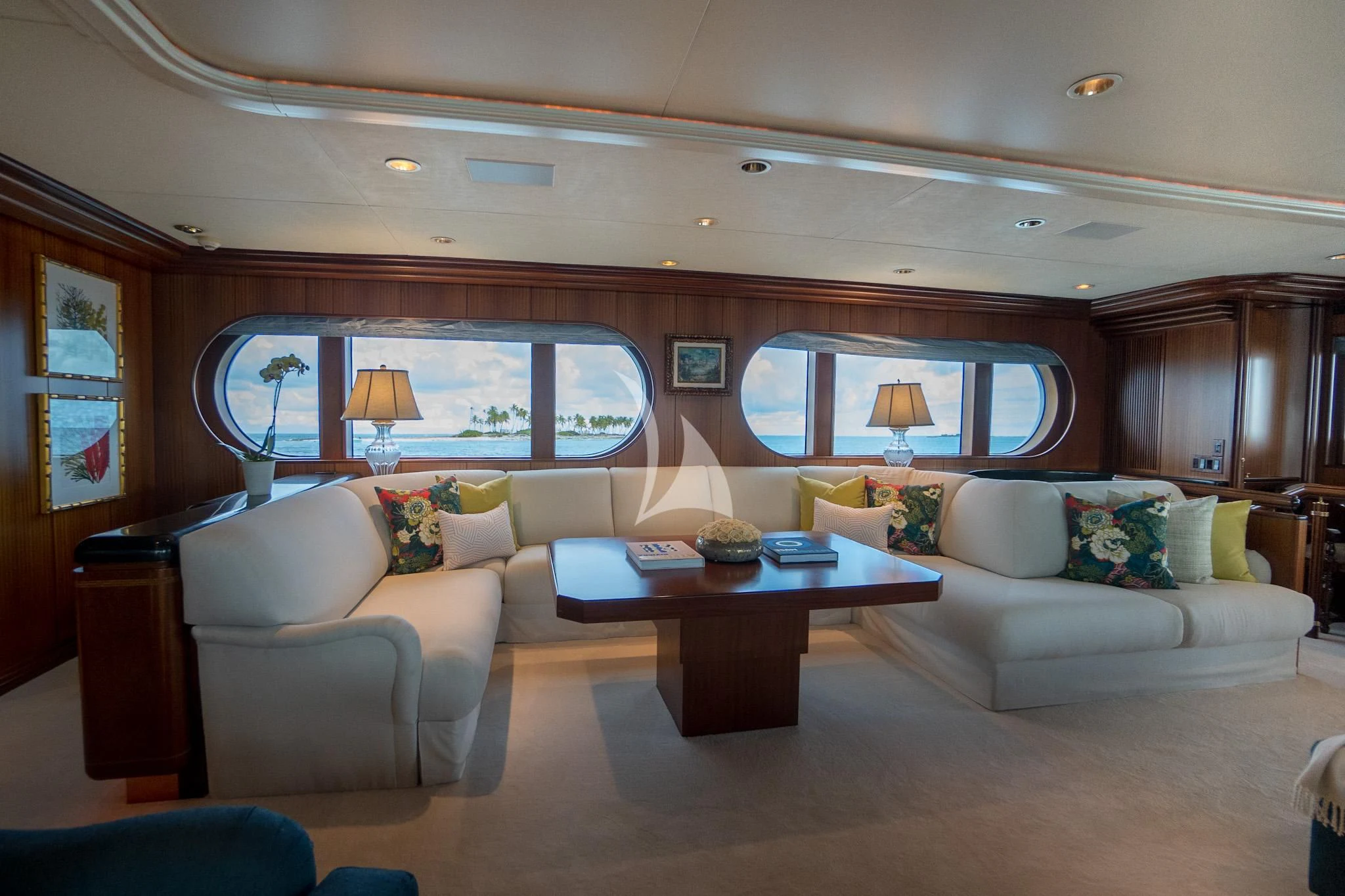 a living room with a large window aboard NEVER ENOUGH Yacht for Charter