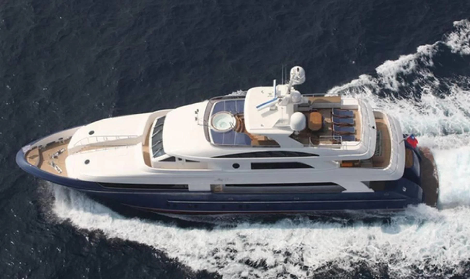 a white car on a snowy mountain aboard NEVER ENOUGH Yacht for Charter