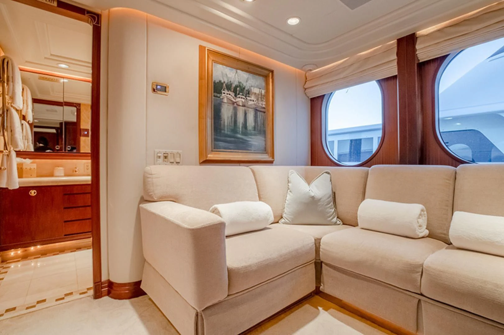 a white couch in a room aboard NEVER ENOUGH Yacht for Charter