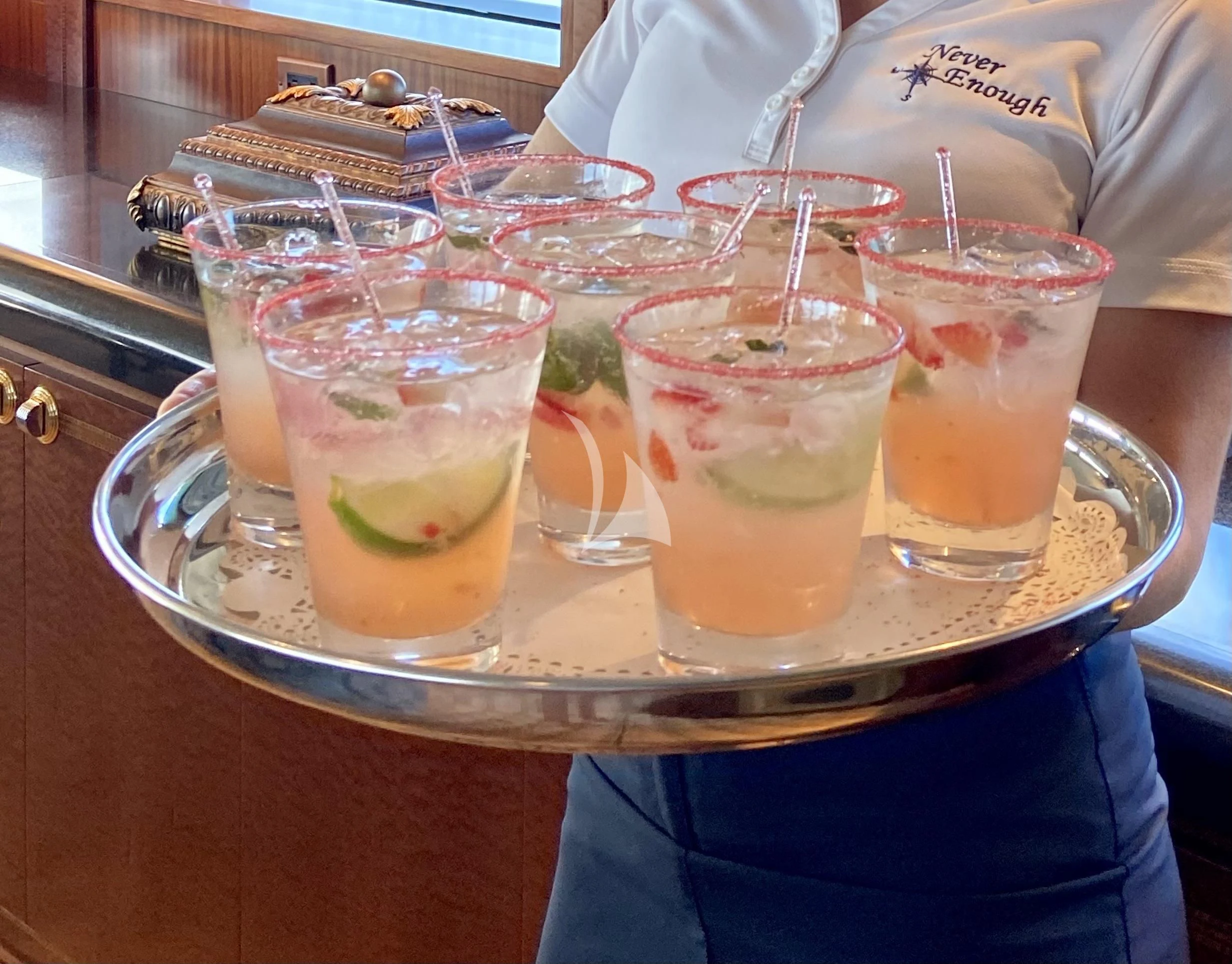 a group of glasses with drinks on a table aboard NEVER ENOUGH Yacht for Charter